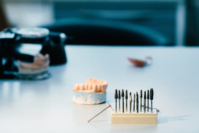 Dentist performing dental implant surgery with advanced equipment in Istanbul