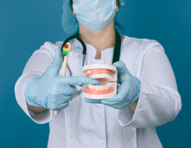 A close-up image demonstrating the proper tooth brushing technique, one of the most important daily oral hygiene tips for maintaining a healthy mouth.