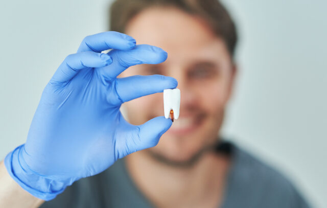 when to stop using gauze after tooth extraction